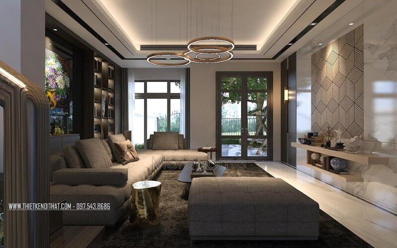 Để tạo ra một không gian phòng khách ấn tượng, hãy kết hợp hài hòa giữa sắc trầm và sáng, cùng với hệ cửa kính lớn để tạo sự thông thoáng và sang trọng.